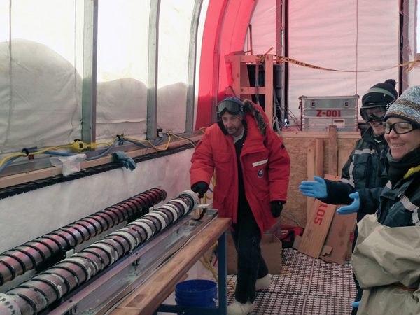 Eric Steig pushes the last core (from 1751 meters depth) out of the drill barrel. Photo credit: Jay Johnson